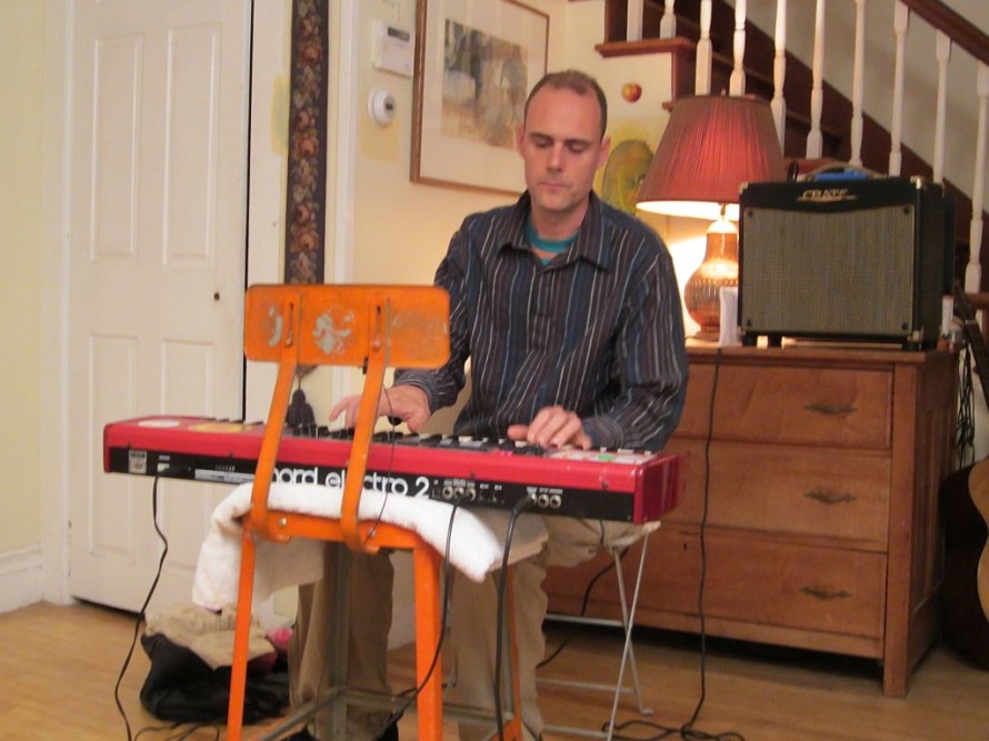 Michael Holt pounding out a tune on his keyboard.